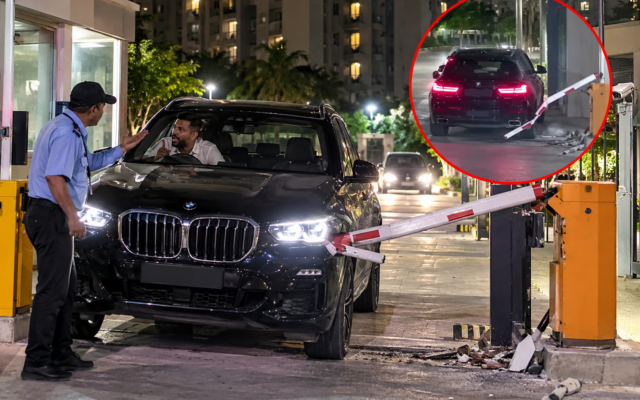 गार्ड से विवाद के बाद BMW चालक ने तोड़ा सोसाइटी का बैरियर